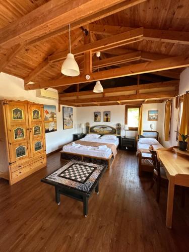 a large room with two beds and a table at Varias Art House in Kallirakhi