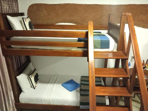 a couple of bunk beds in a room at The Nature Park Villa in Sigiriya