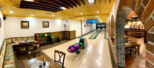 an overhead view of a bowling alley in a restaurant at Hotel Bílý Beránek Kralovice in Kralowitz