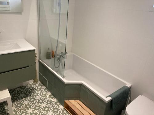 a bathroom with a shower and a sink at Les Tourellières 