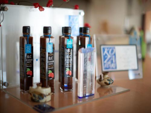 a group of four bottles sitting on a table at Crown Hotel Okinawa in Okinawa City