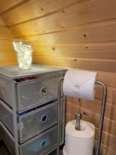 a bathroom with a toilet and a roll of toilet paper at Casa Aura in Aura