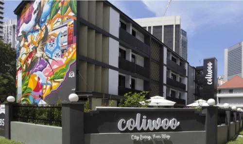 a building with a mural on the side of it at Coliwoo Keppel - CoLiving in Singapore