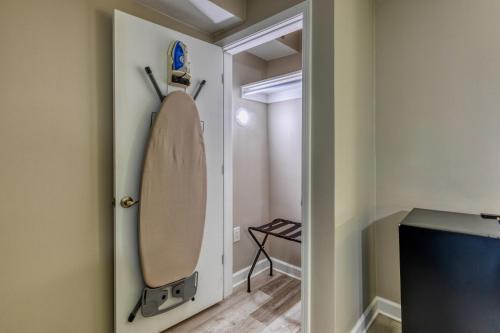 a room with a door with a surfboard on the wall at Hotel Weston in Marietta