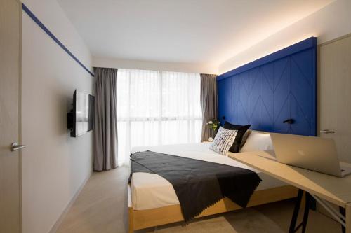 Postel nebo postele na pokoji v ubytování Coliwoo Keppel - CoLiving