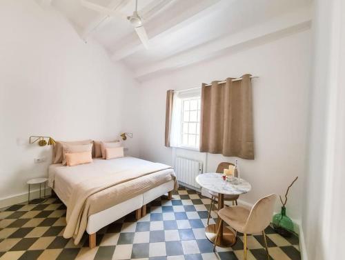 A bed or beds in a room at Canostra Menorca Alaior