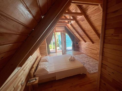 an overhead view of a bedroom in a wooden house at Palma Rosa Hotel in Kemer