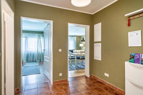 a hallway with a door leading to a dining room at Apfelbaum in Friedrichshafen