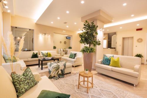 a large living room with couches and a table at Hotel Balaton in Riccione