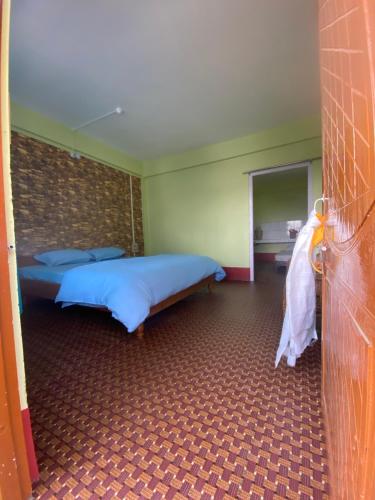 Ένα ή περισσότερα κρεβάτια σε δωμάτιο στο DPM HOMESTAY