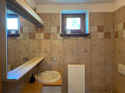 a bathroom with a sink and a window at Bibc Wine & Holiday in Trieste