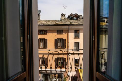 a view of a building from a window at Aosta Holiday Apartments - Sant'Anselmo in Aosta