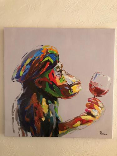 a painting of a parrot with a wine glass at Appart Hotel Au Pied de Vigne in Vresse-sur-Semois