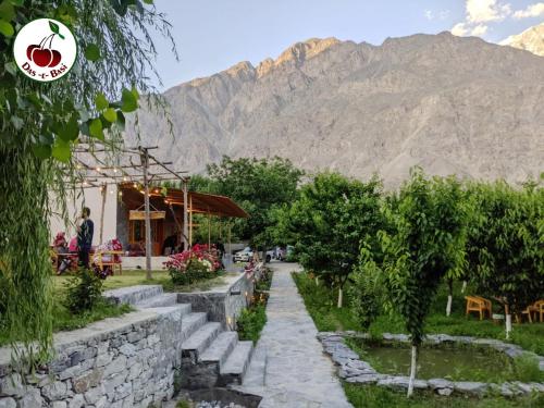 a resort with a mountain in the background at Das-e-Basi in Gilgit