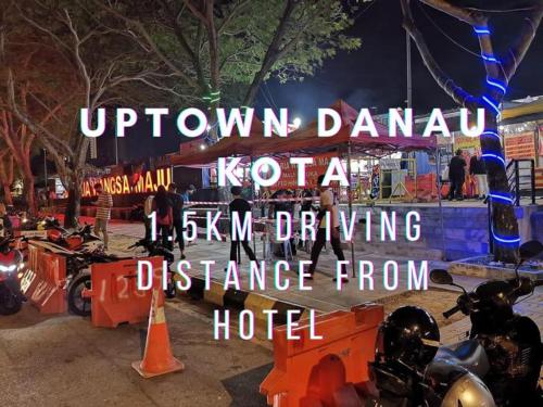 a sign that reads uptown banquet koptkaikiiki six km driving distance at Seeds Hotel PV128 Setapak in Kuala Lumpur