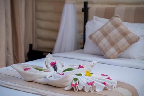 a couple of towels on top of a bed at Taita Hills Safari Resort & Spa in Tsavo