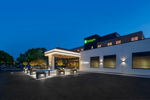 a store front of a building at night at Holiday Inn Southampton Eastleigh by IHG in Southampton