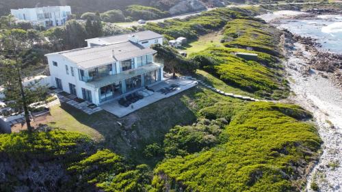an aerial view of a house on the beach at Marlin Manor in Struisbaai
