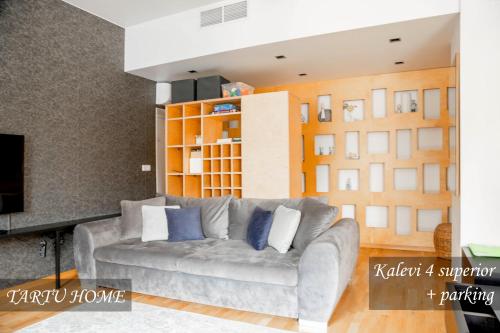 a living room with a couch and a tv at City Center Turu str apartments, parking, Tartu Home in Tartu