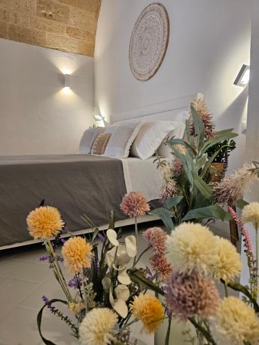 Giường trong phòng chung tại Vecchia Mottola Albergo Diffuso