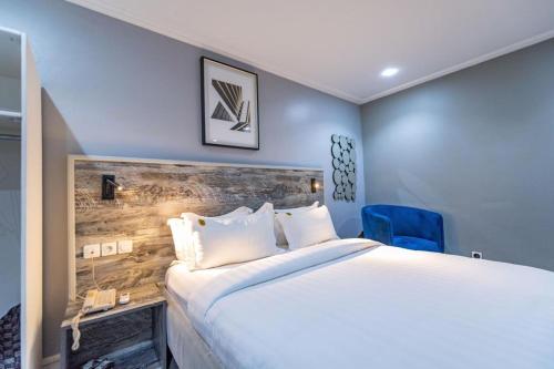 Säng eller sängar i ett rum på Villa Magnum