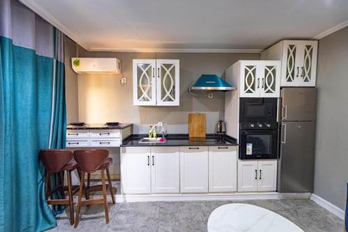 Una cocina o zona de cocina en Villa Magnum