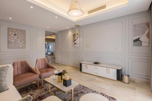 a living room with a couch and a table at Gewan Resort New Alamein in El Alamein