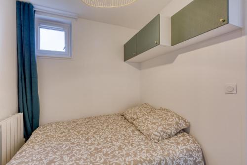 Postel nebo postele na pokoji v ubytování Le Colbert - Appt moderne pour 4 voyageurs