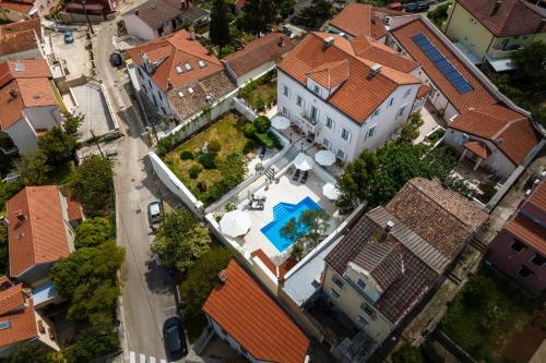 an overhead view of a house with a swimming pool at Villa Cassia in Mali Lošinj