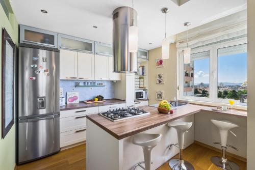 Kuchyň nebo kuchyňský kout v ubytování Apartment Natali