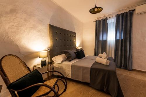 Postel nebo postele na pokoji v ubytování APARTAMENTO HOSPEDERÍA FRANCISCANA