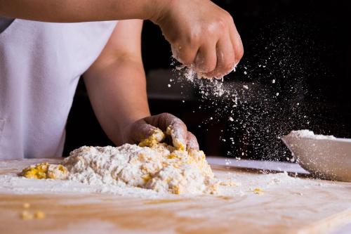 a person is mixing ingredients in a bowl at Casa Di Mi in Serrungarina