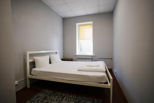 Una cama o camas en una habitación de P2B hostel & bar
