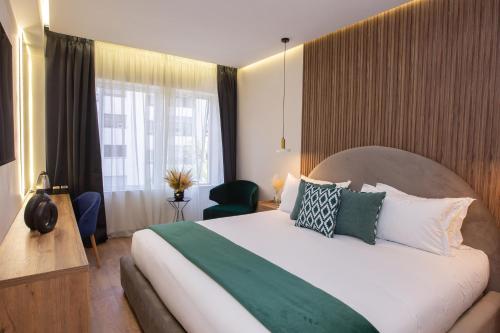 Postel nebo postele na pokoji v ubytování Le M Hôtel