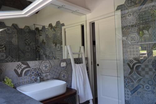 a bathroom with a white sink and a shower at Villa Pontecorvo with Swimming Pool in Sant'Agnello