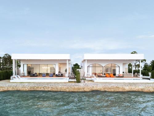 an image of a house from the water at Sea Season Pool Villa Pattaya in Bang Lamung