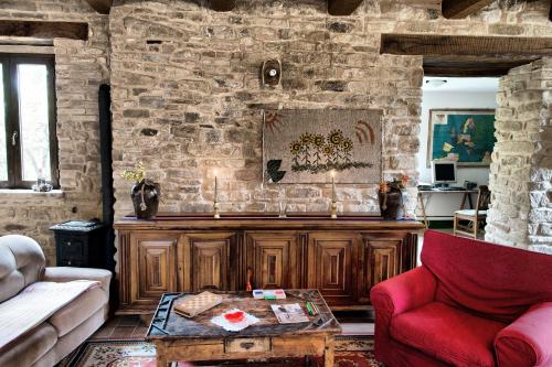a living room with a couch and a table at Villa Aurora by Mmega in Monte Rinaldo