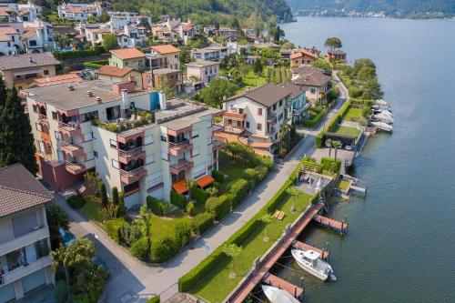 an aerial view of a town next to a body of water at Casa Bader in Riva San Vitale