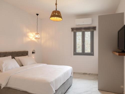 Posteľ alebo postele v izbe v ubytovaní The George Villas with Private Pool, close to Mykonos Town - Chora