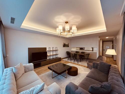a living room with a couch and a table at Maslak Aparts in Istanbul