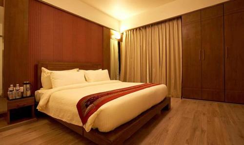 Postel nebo postele na pokoji v ubytování Hotel Prime Ivy Studio