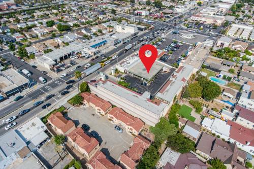 an overhead view of a city with a red marker at Omeo Suites in Alhambra