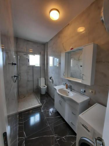 a bathroom with a sink and a shower at Arlis House in Golem