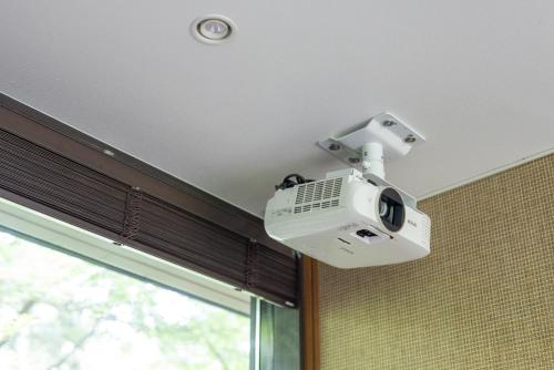 a security camera is on the ceiling of a room at La Maison Karuizawa in Karuizawa