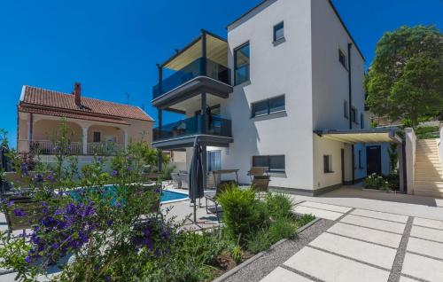 Modern apartments with shared pool near the sea