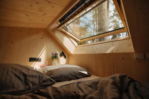 a room with two beds and a window at Cabin28 in Lubmin