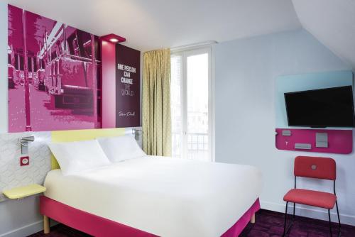 Ibis Styles Paris Crimée La Villette tesisinde bir odada yatak veya yataklar