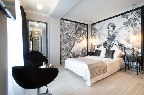 a bedroom with a bed and a large window at Cincis by the Lake in Cinciş