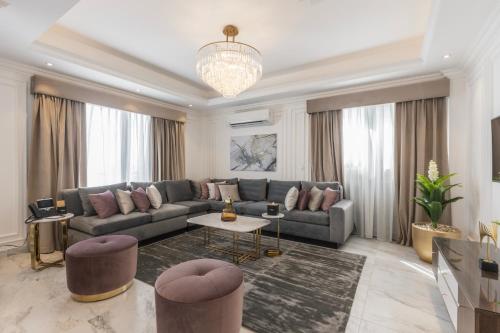 a living room with a couch and a table at Gewan White Beach Resort-New Alamein in Marsa Matruh