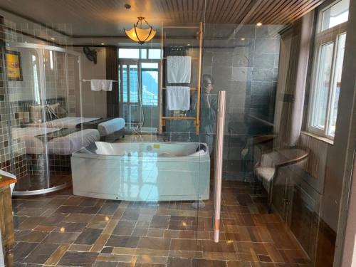 a large bathroom with a tub and a shower at citybay homestay ha long 3BR in Ha Long